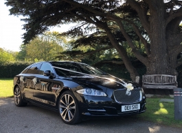 Black modern Jaguar XJ for wedding hire in Portsmouth