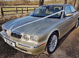 Gold Jaguar XJ for weddings in Buckingham